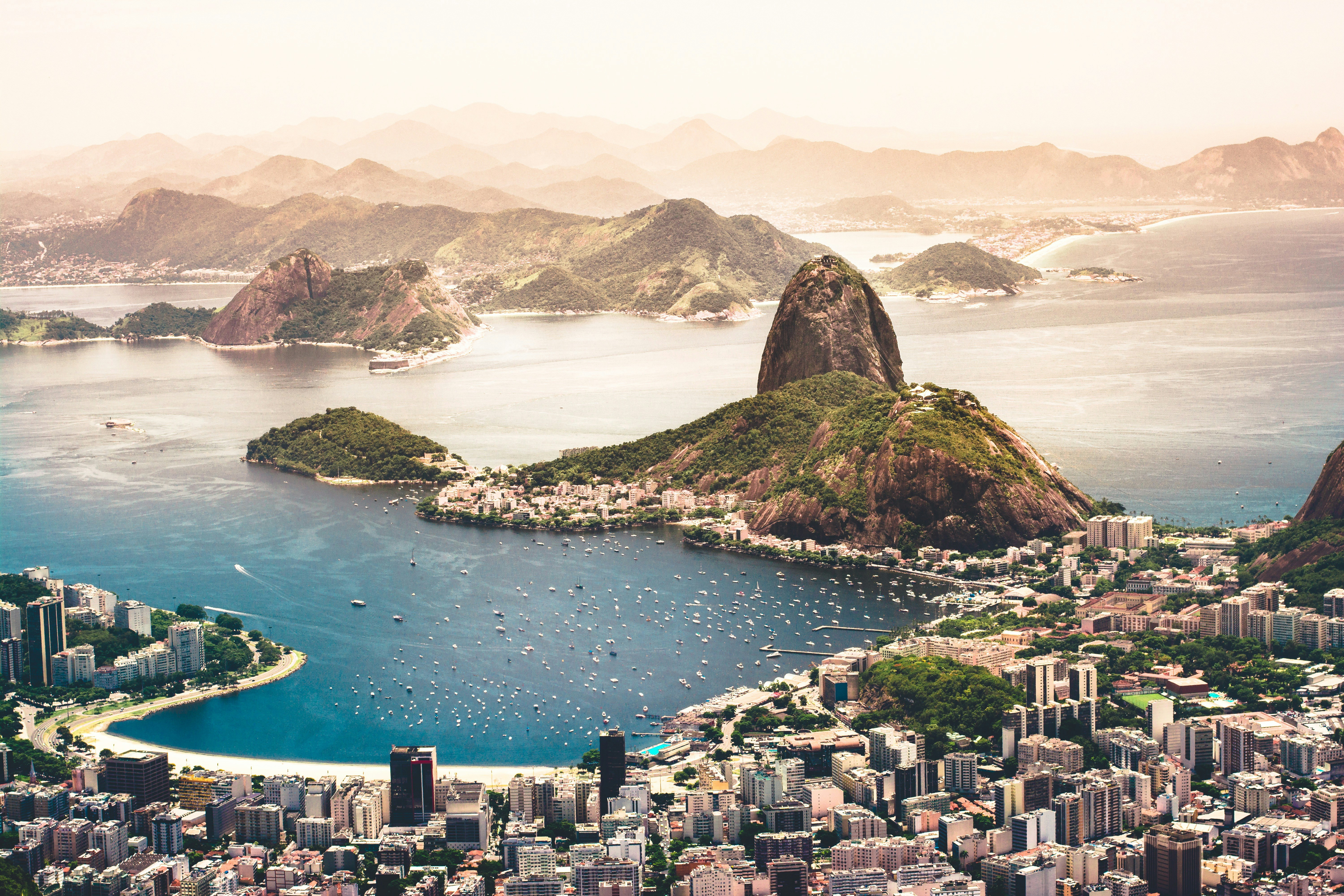 A breathtaking panoramic view of Rio de Janeiro with the Christ the Redeemer statue overlooking the city and Guanabara Bay